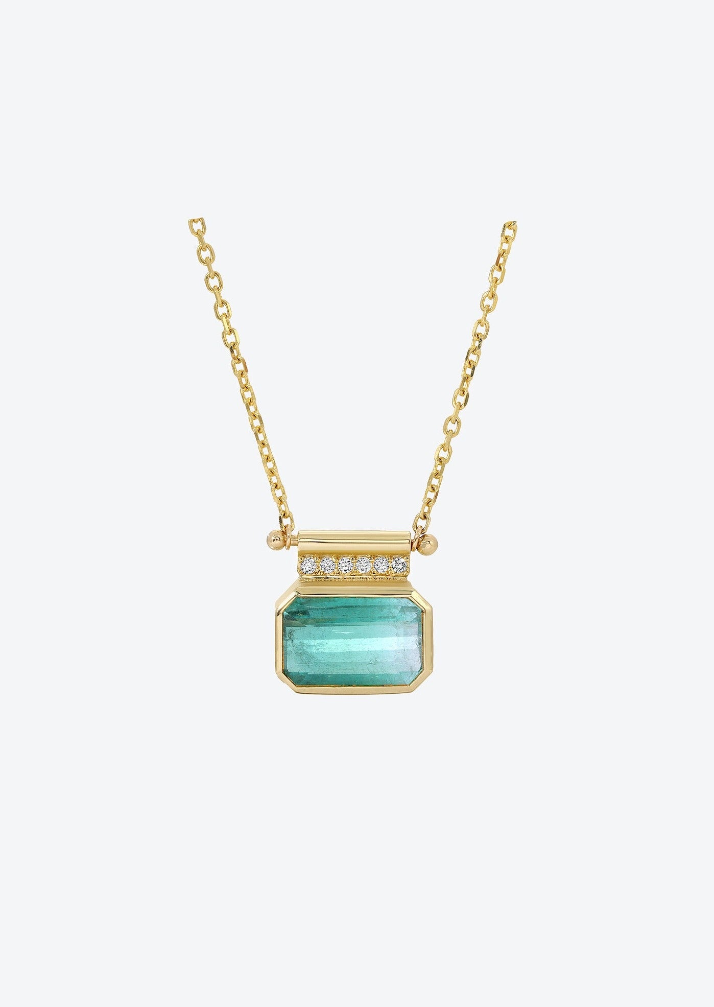 Diamond pendant necklace featuring blue tourmaline and gold cable chain