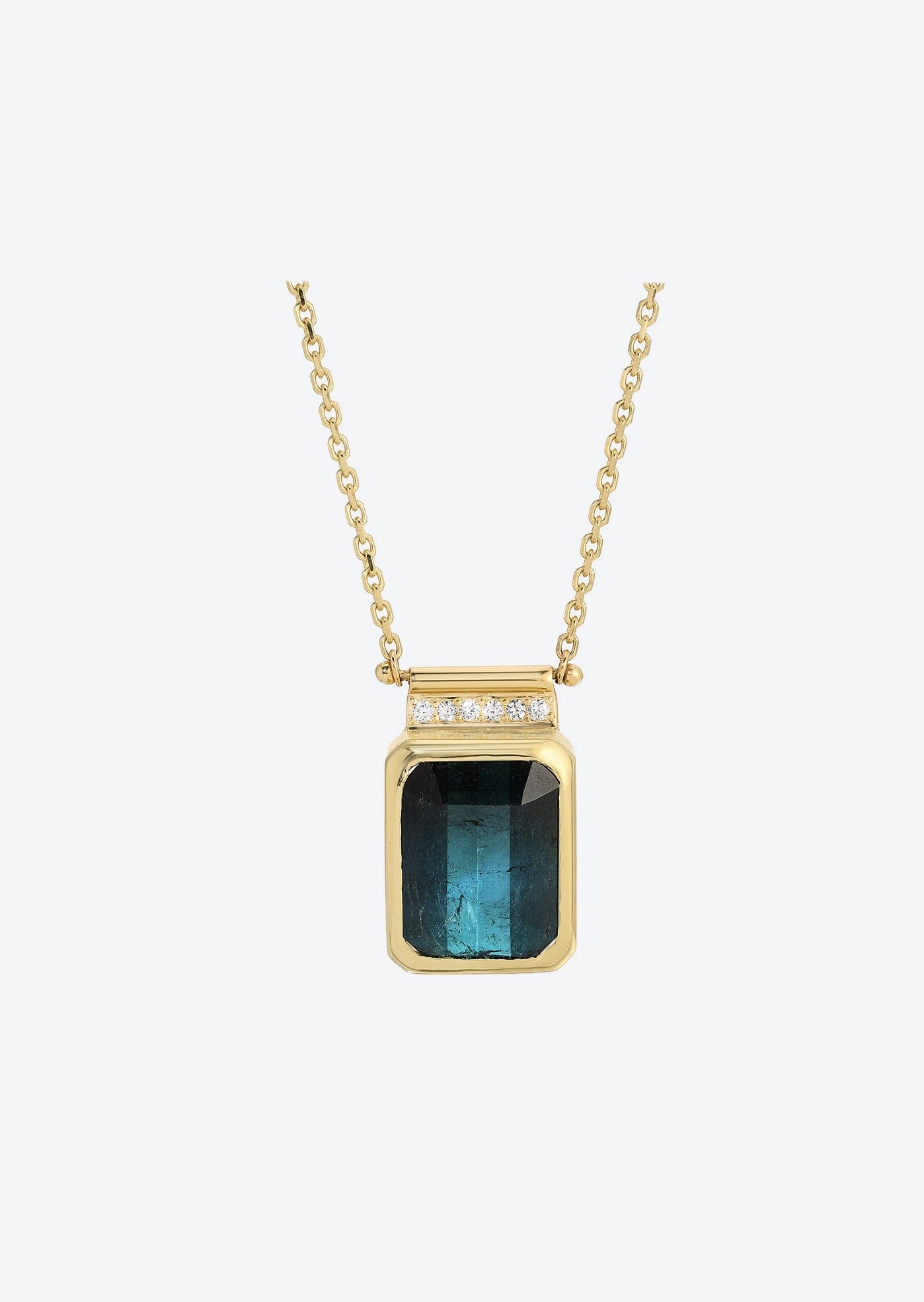 Inky blue tourmaline pendant with diamond accents on gold chain