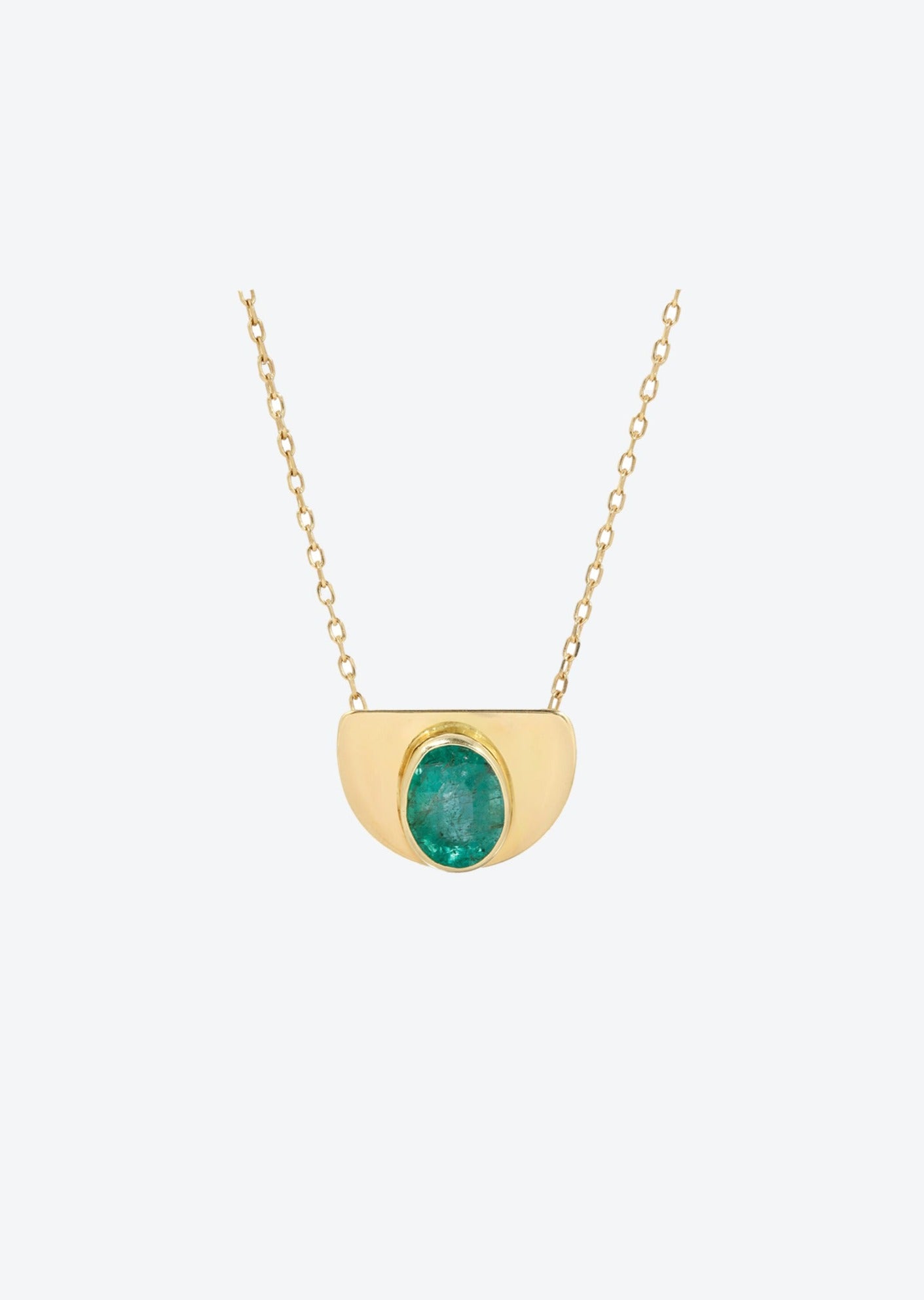 Solid gold pendant necklace charm featuring oval emerald cabochon