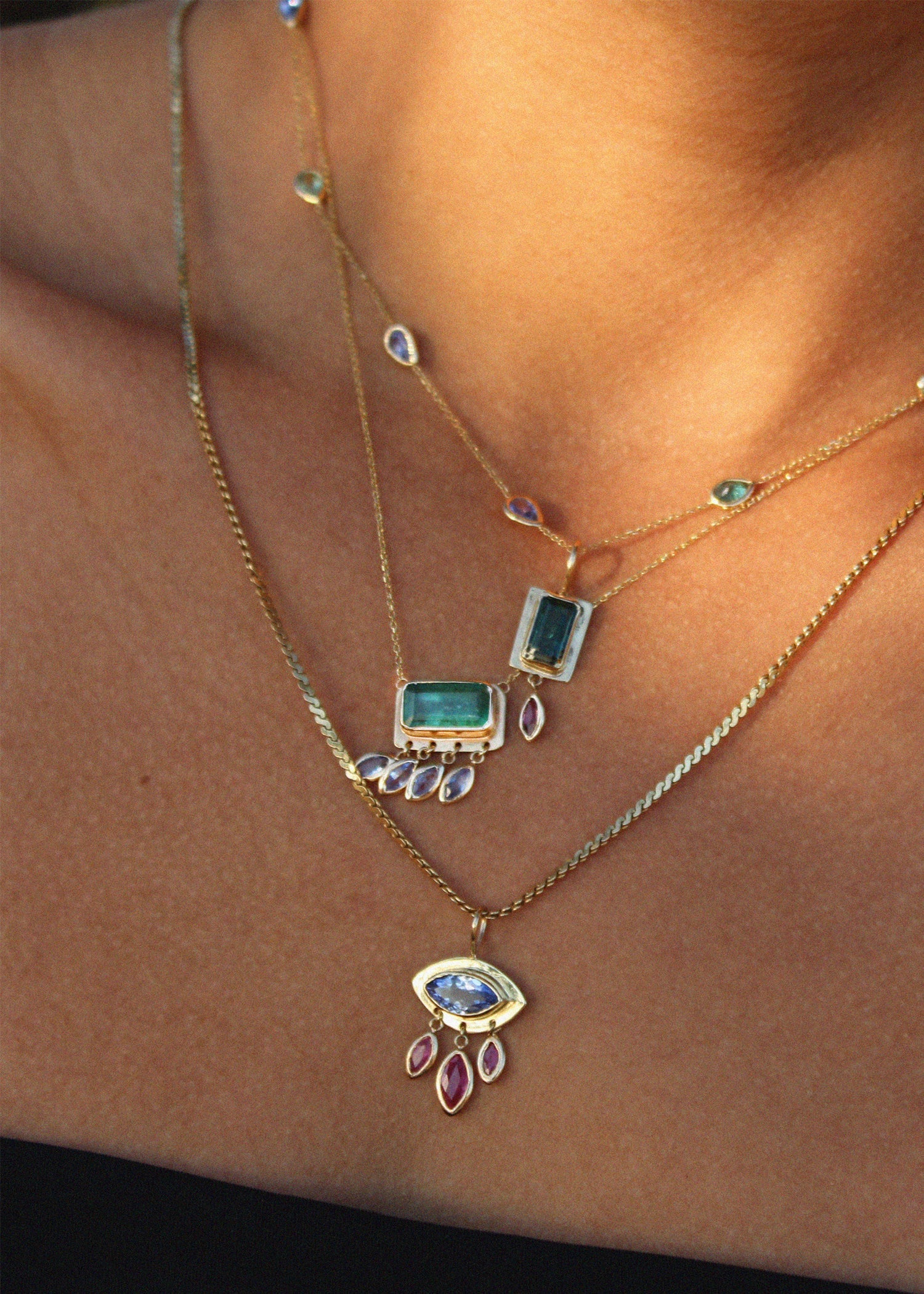 Pendant necklace stack dangling jewelry charms featuring tourmaline and tanzanite gemstones