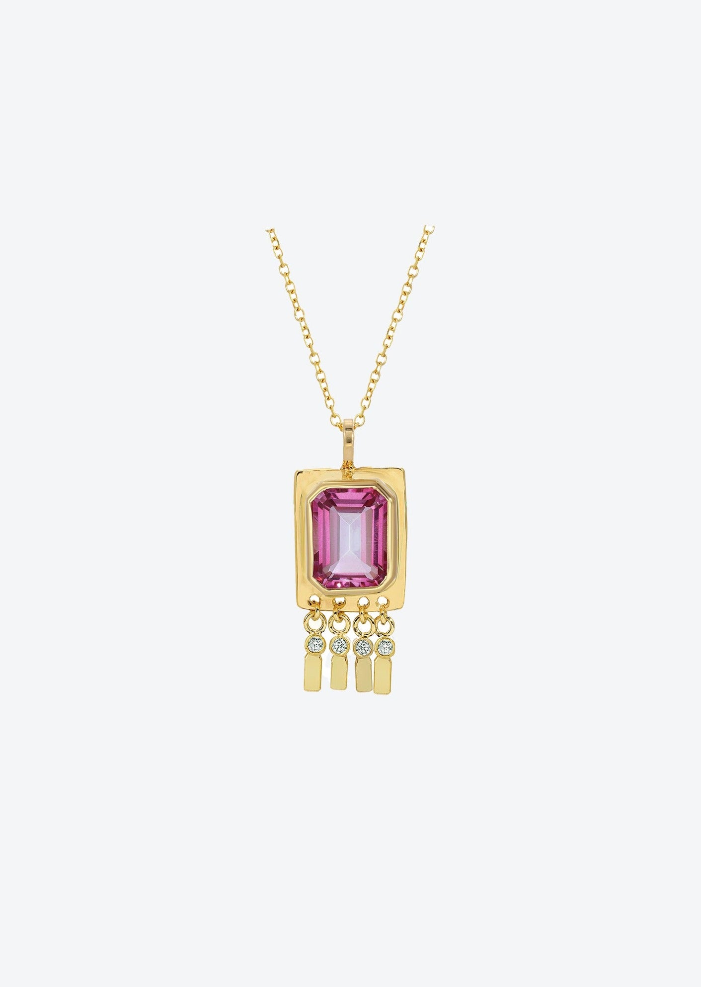 Gold pendant necklace with pink tourmaline centerpiece and diamond drops, designed for layering or solo wear as a gold charm statement piece.