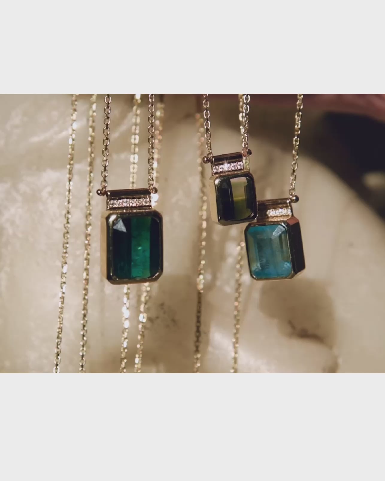 Dainty gold gemstone necklaces featuring unique tourmalines and diamonds