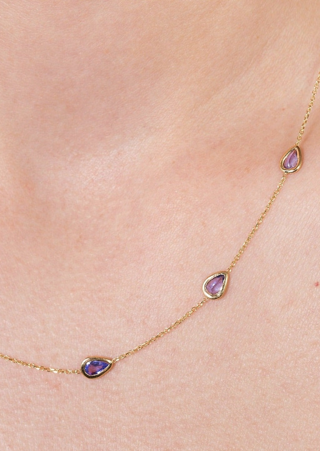 Dainty station necklace with tanzanite drop on an adjustable gold chain