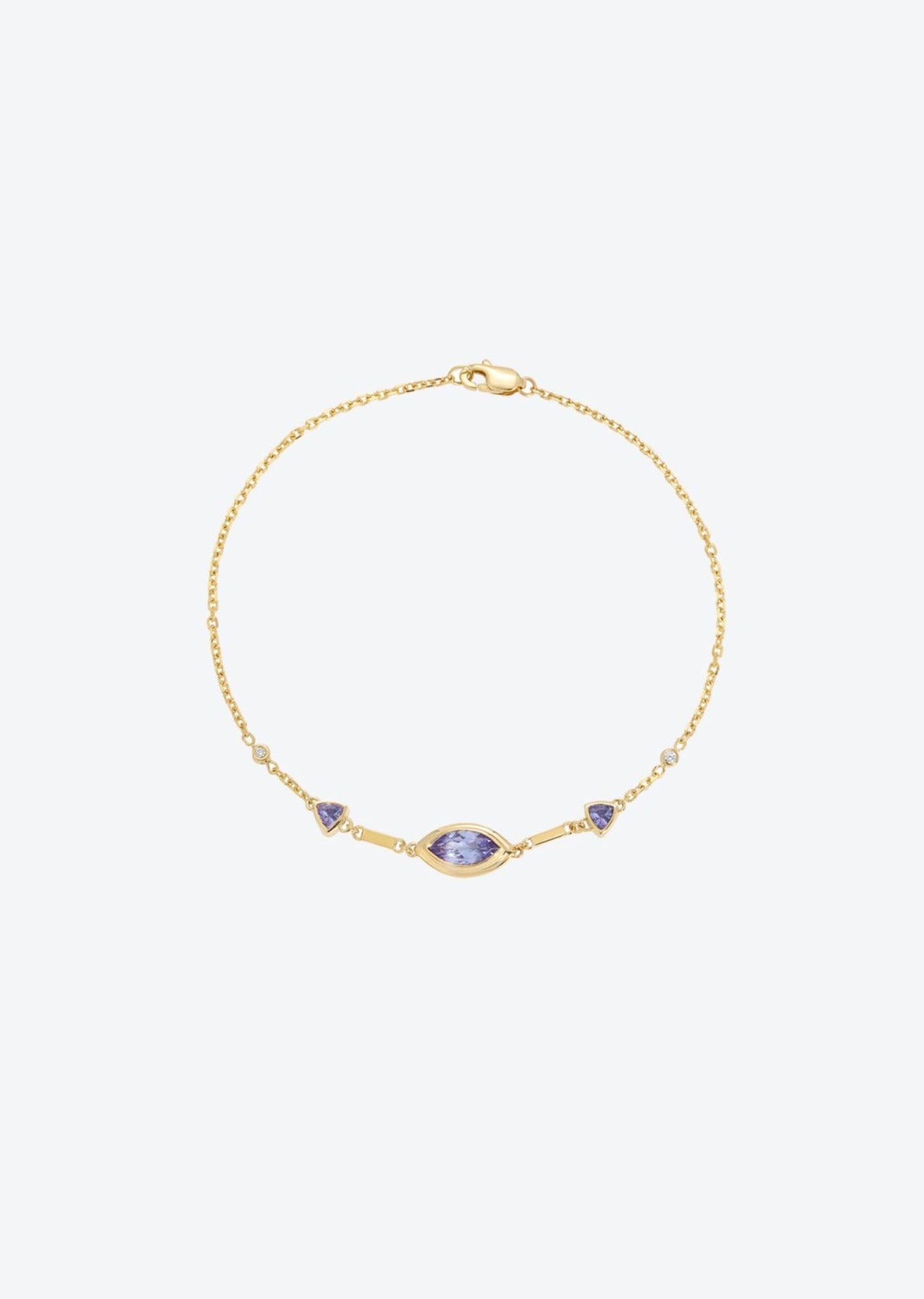 Dainty Gold chain eye bracelet featuring tanzanite stones and diamond details, designed for versatile wear