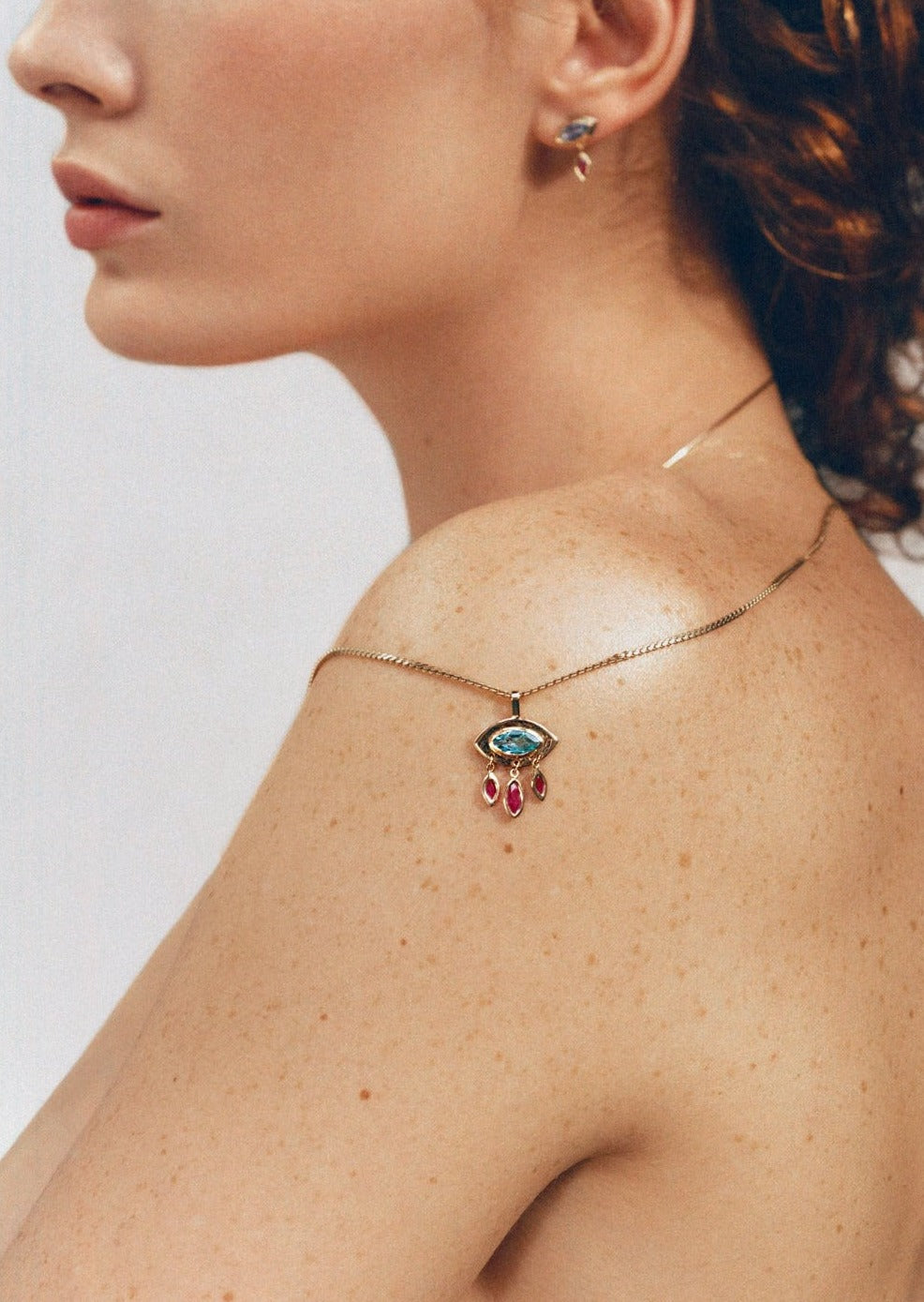 Evil Eye Pendant and Topaz Jewelry | Christina Magdolna