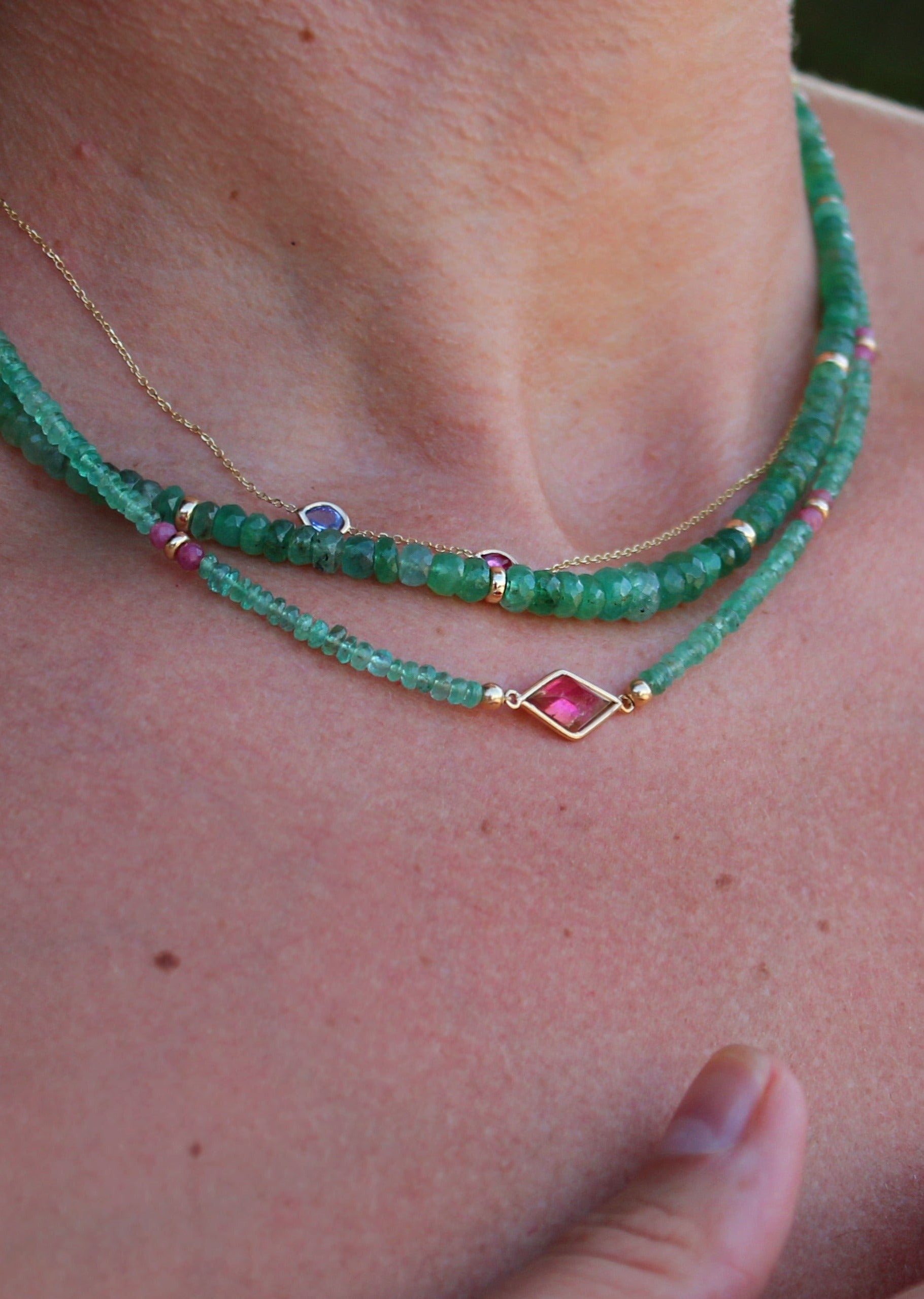 Handcrafted green emerald necklace featuring gold bead spacers, designed for layering or solo wear as summer jewelry.