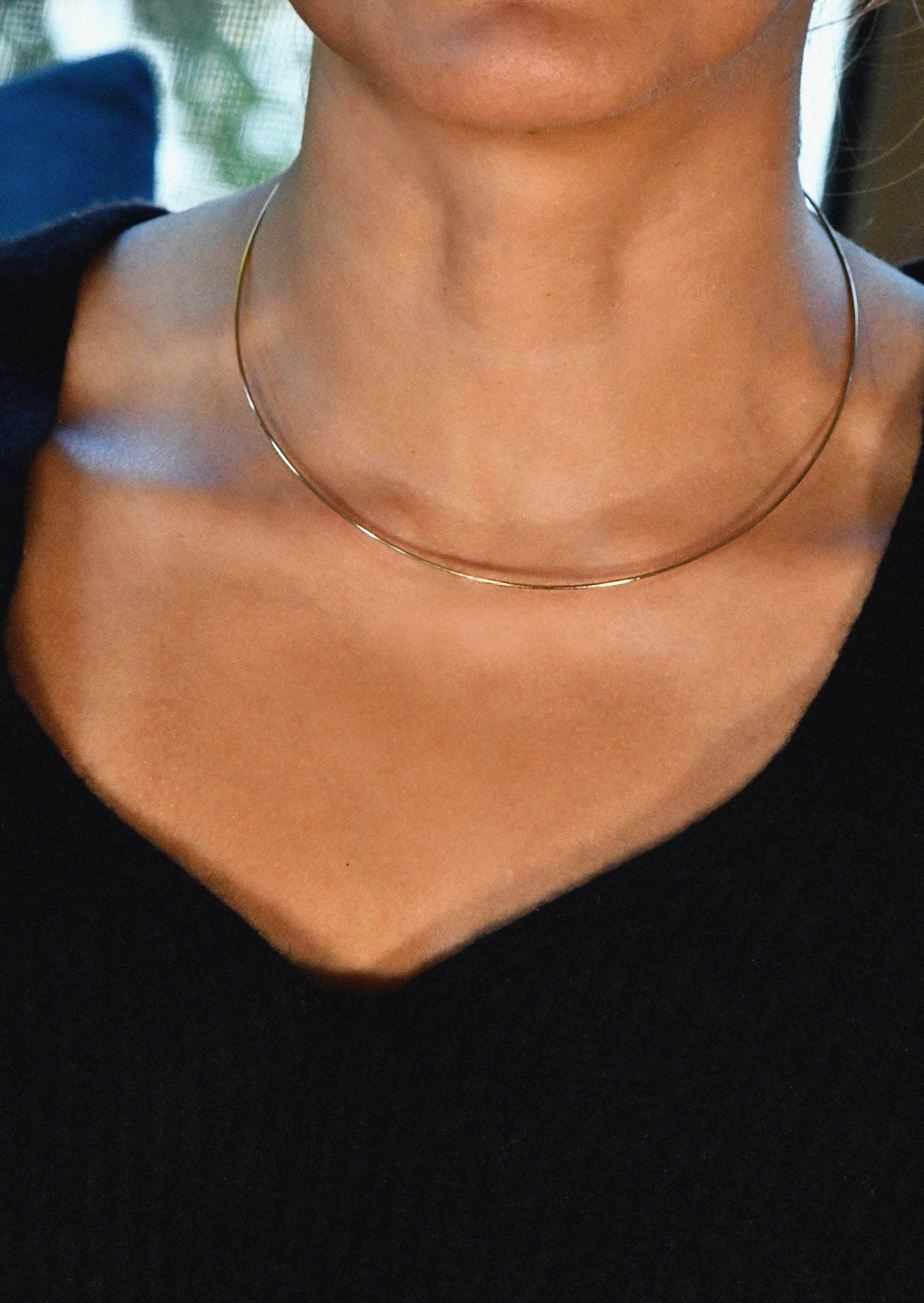 Minimalist gold collar necklace crafted in 14K yellow gold with polished finish