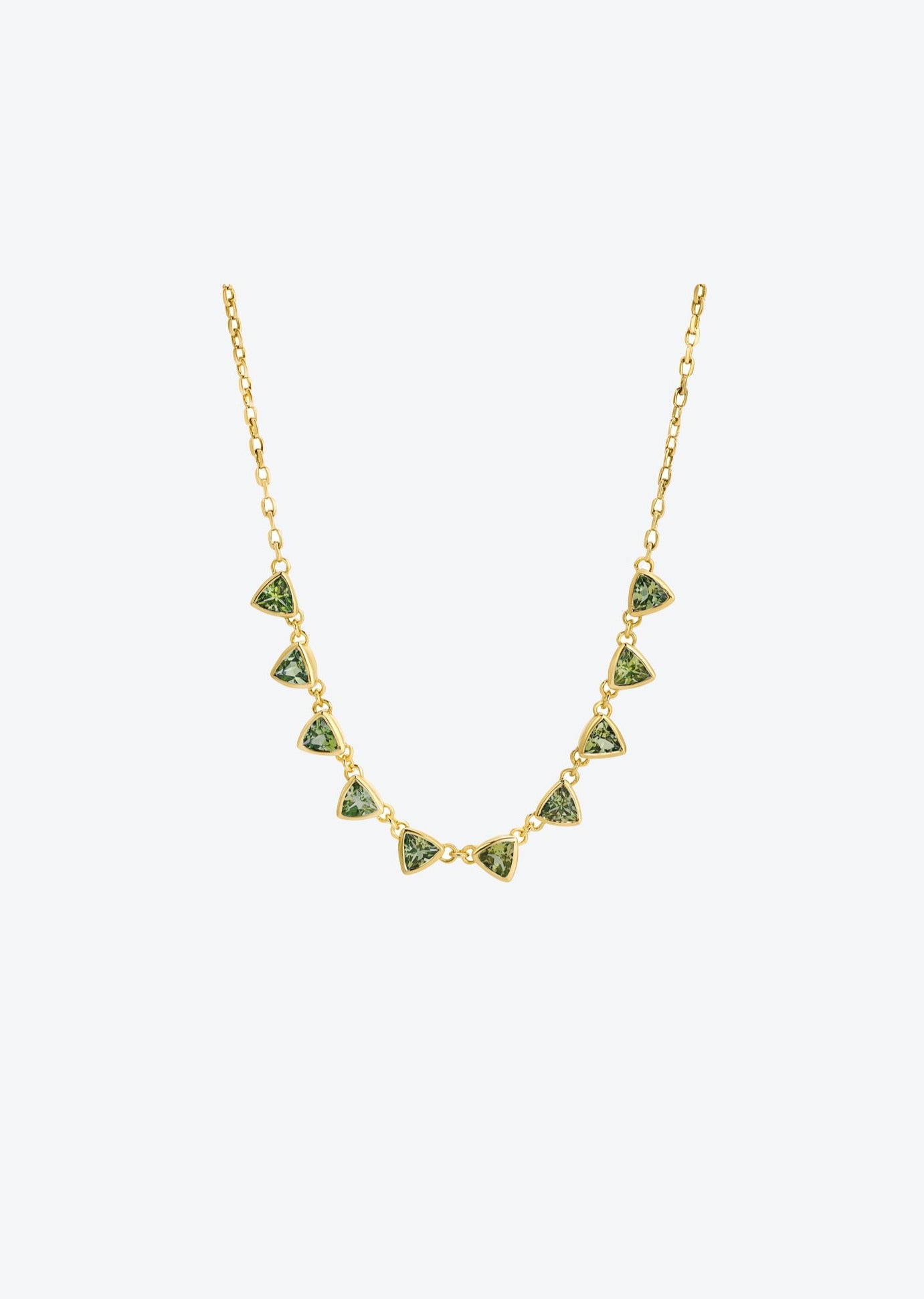 Handcrafted gemstone necklace featuring trillion-cut green tourmalines and gold chain