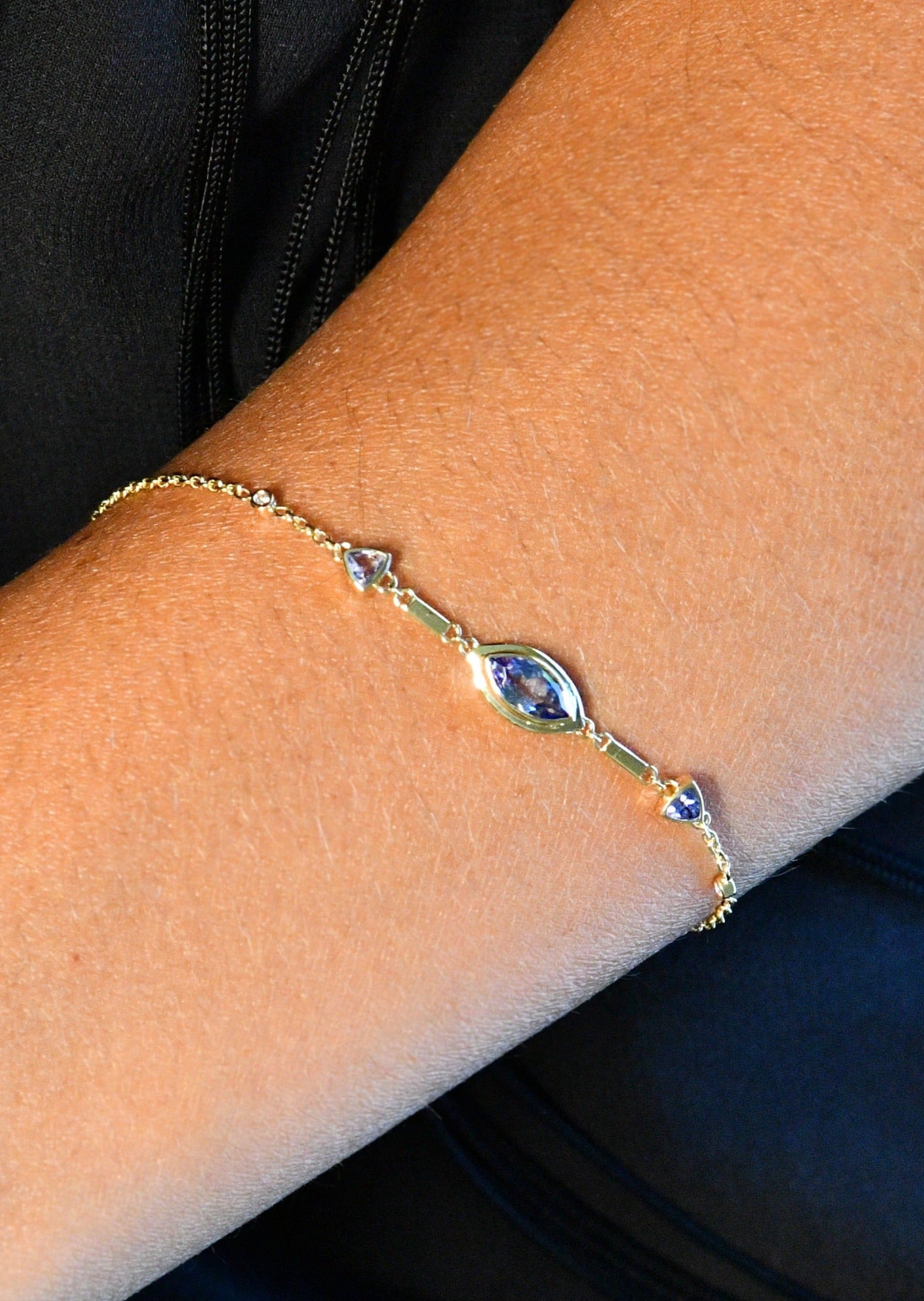 Elegant tanzanite and diamond eye bracelet crafted in 14K gold, ideal for boho-inspired or everyday styling.