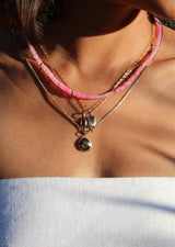 woman wearing pink opal beaded necklace