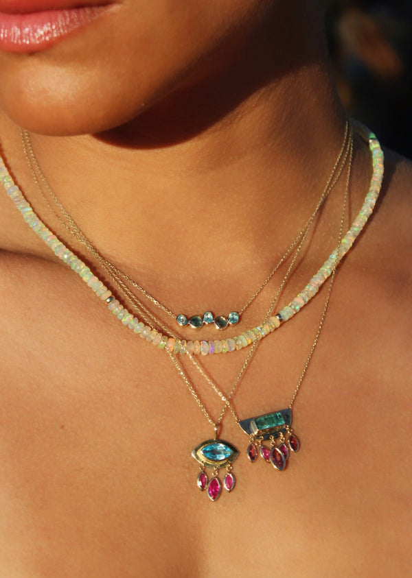 woman wearing white opal beaded necklace